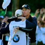 Jim Furyk and his caddie, Fluff, after shooting a round of 59 at the BMW Championship at Conway Farms Golf Club